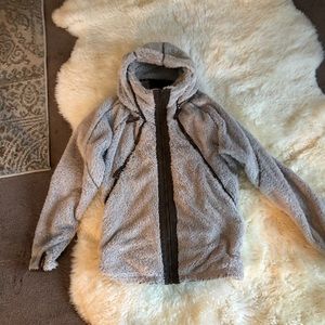A size Large Kuhl fleece with a zippered in hood